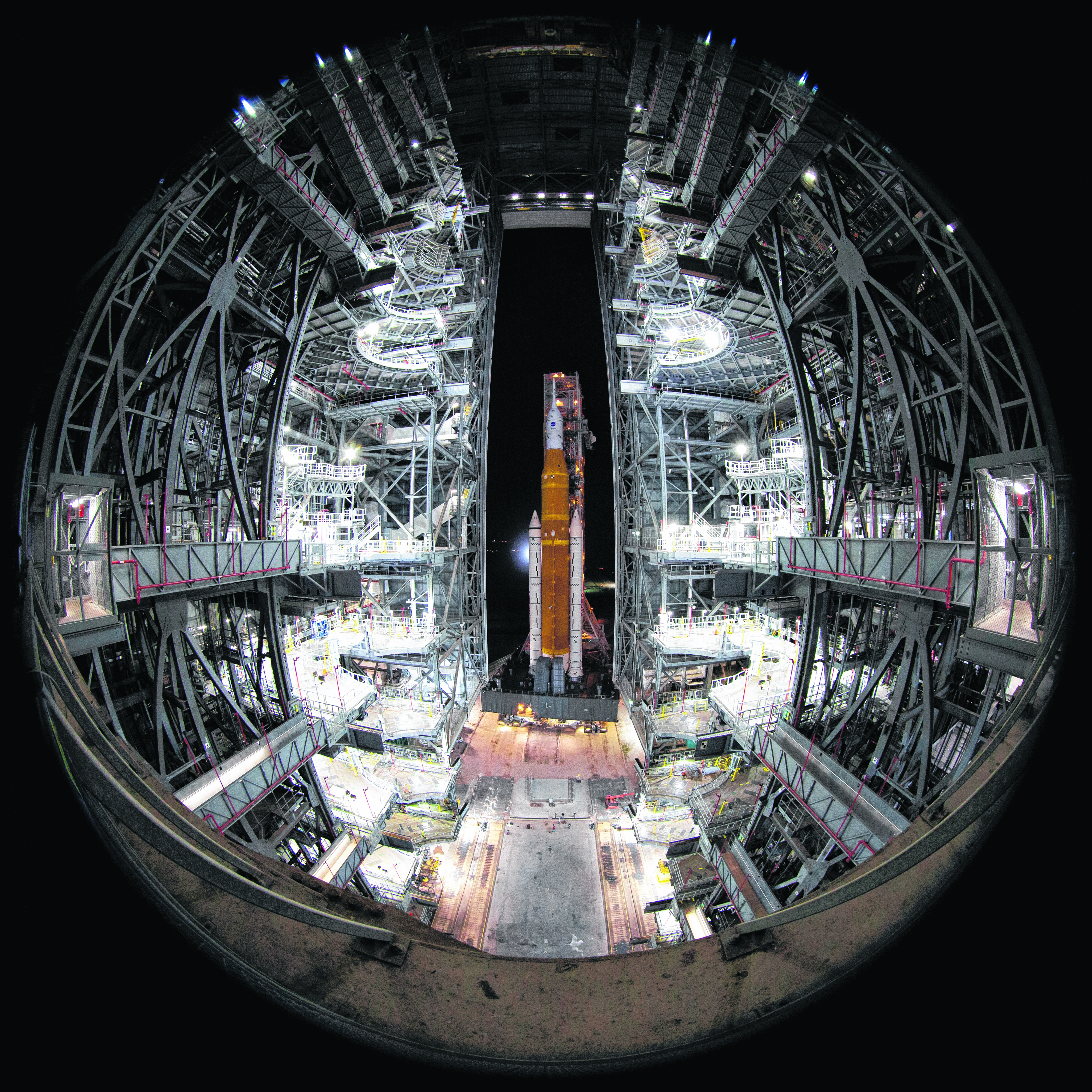 NASA's Space Launch System (SLS) rocket with the Orion spacecraft aboard is seen atop the mobile launcher as it rolls out to Launch Pad 39B, Friday, Nov. 4, 2022, at NASA's Kennedy Space Center in Florida. (Joel Kowsky/NASA via AP)