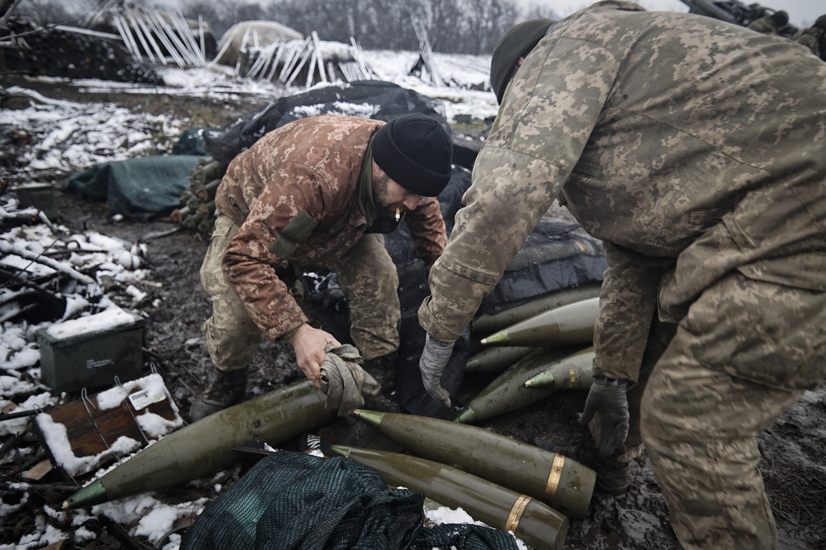 Ukrainian servicemen prepare to fire at Russian positions in the frontline at an undisclosed location in the Donetsk region, Ukraine, Wednesday, Nov. 23, 2022. (AP Photo/Roman Chop)