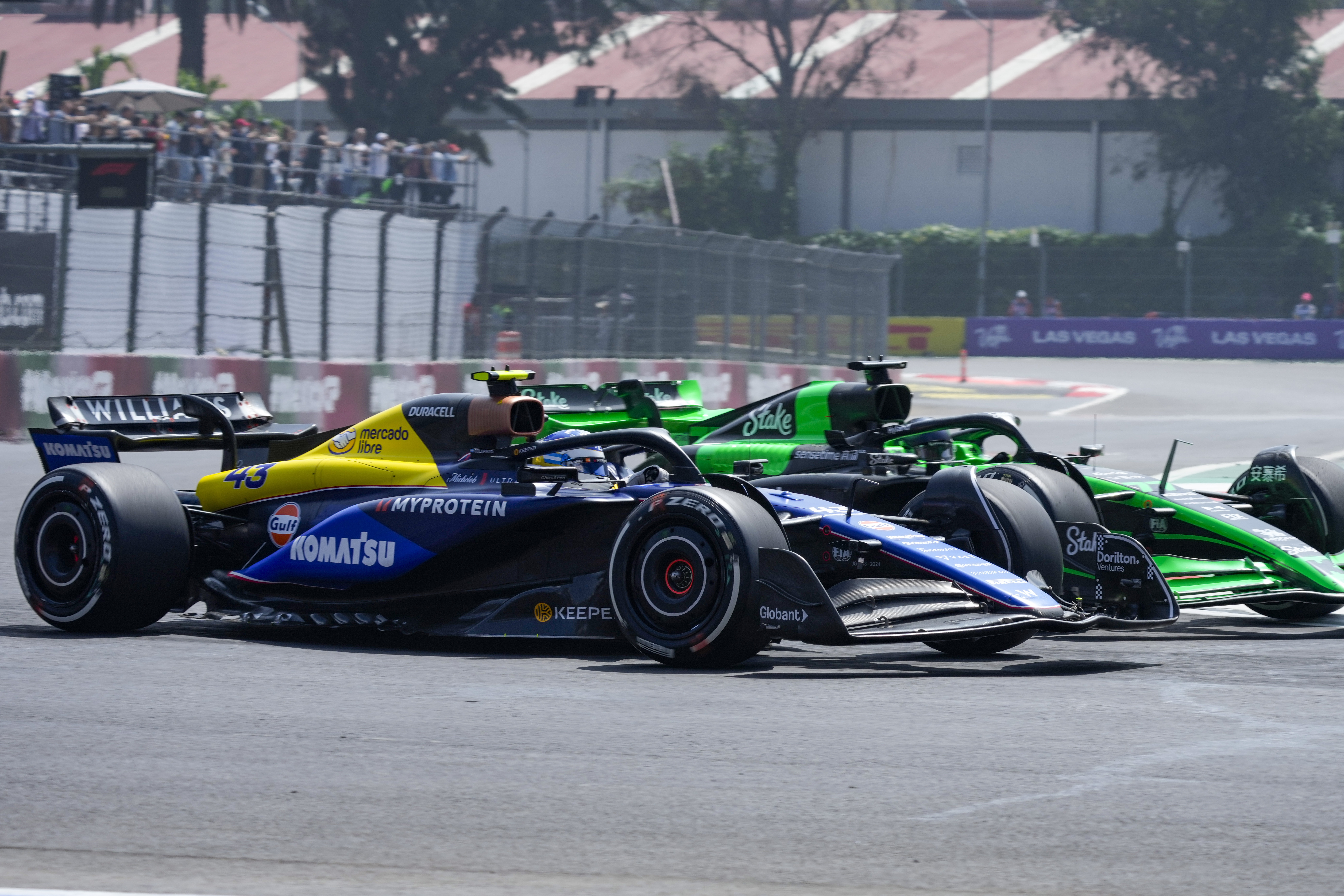 Williams driver Franco Colapinto, of Argentina, front, and Kick Sauber driver Valtteri Bottas, of Finland, steer through a turn during the first free practice ahead of the Formula One Mexico Grand Prix auto race at the Hermanos Rodriguez racetrack in Mexico City, Friday, Oct. 25, 2024. (AP Photo/Moises Castillo)